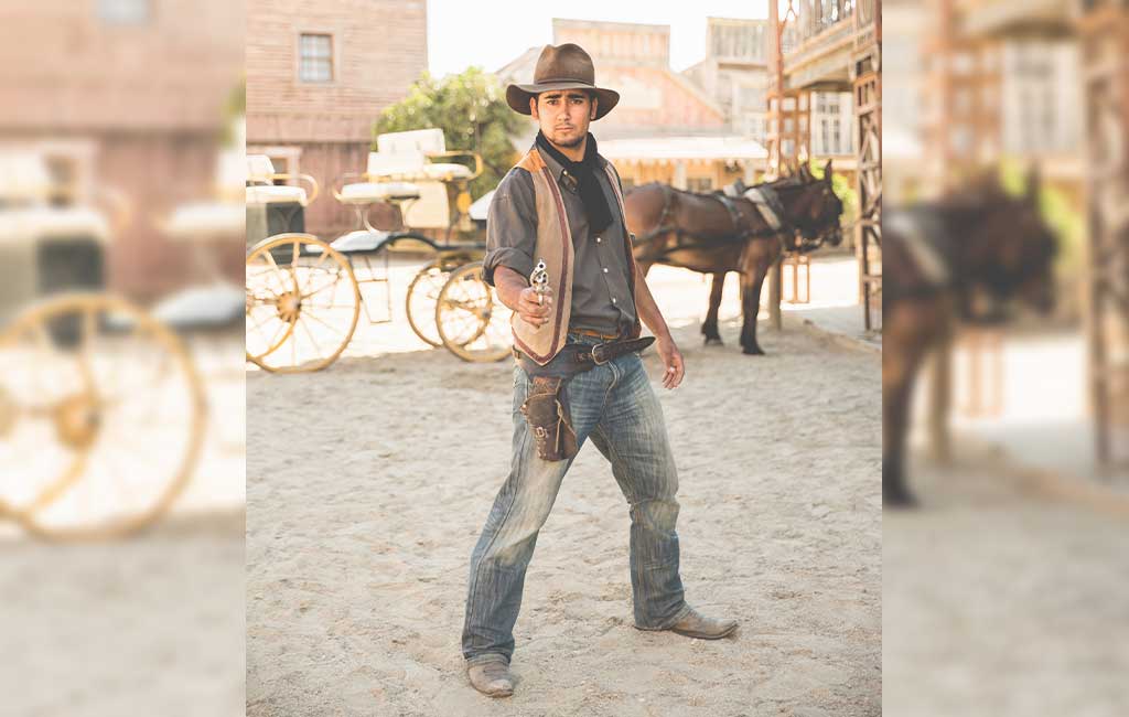 Cowboy Pointing Gun On Wild West Film Set